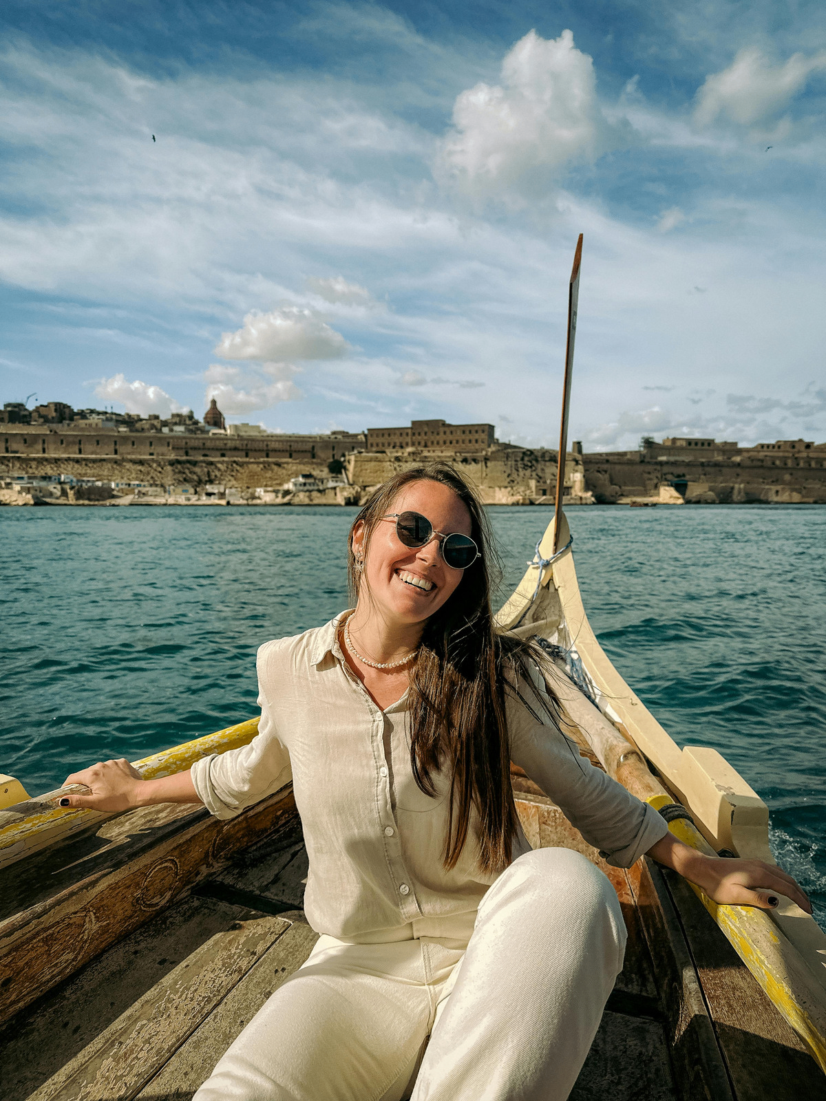 Owner enjoying a traditional Maltese boat ride with Valletta in the background