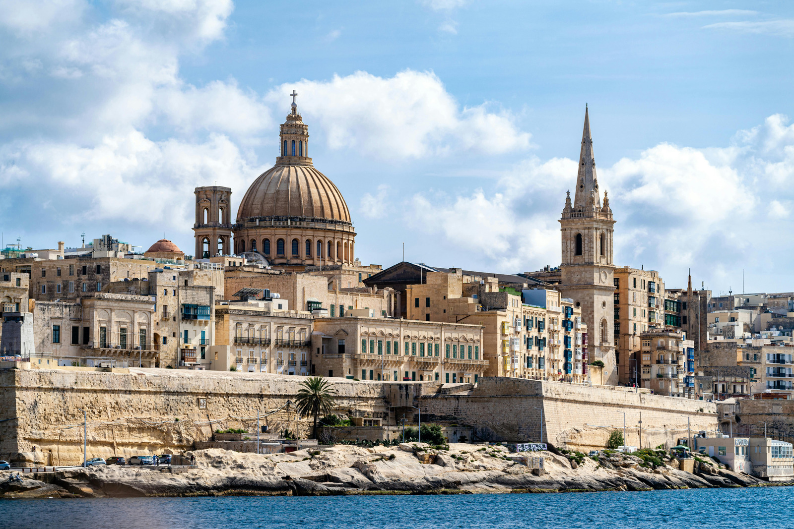 Valletta skyline with its iconic dome and bell tower viewed from the harbour